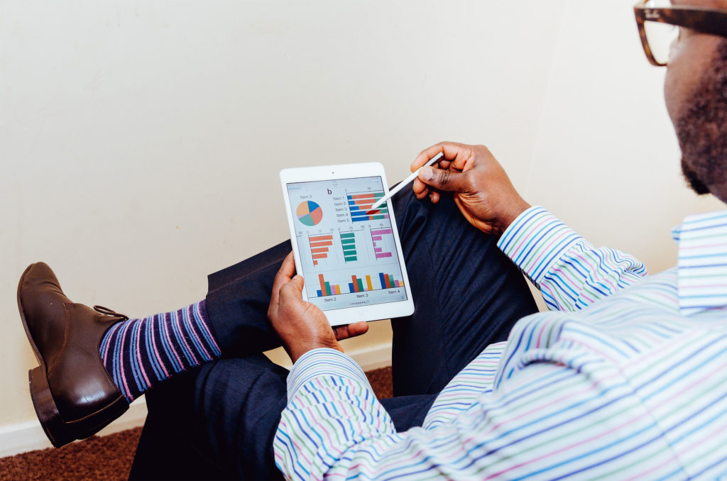 Man using stylus on tablet