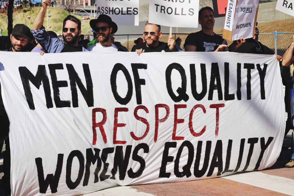 "Men of quality respect women's equality" banner