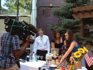 Girls being filmed at table